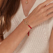 Load image into Gallery viewer, Adjustable butterfly string bracelet being worn by a model on her right wrist
