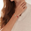 Load image into Gallery viewer, Round Tree of Life Red String Bracelet in a white background worn by a model on her right wrist
