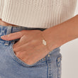 Load image into Gallery viewer, White Stone Hamsa Hand Gold Chain Bracelet on a model&#39;s wrist
