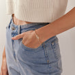 Load image into Gallery viewer, A model wearing Hamsa Hand Stoned Gold Chain Bracelet
