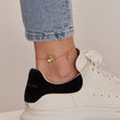 Load image into Gallery viewer, Sunflower Gold Ankle Bracelet worn on the ankle by a mother wearing a white shoe
