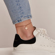 Load image into Gallery viewer, Sun Rose Gold Ankle Bracelet worn on the ankle by a model wearing a white shoe
