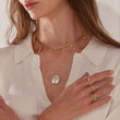 Load image into Gallery viewer, Round Tree of Life Pearl Silver Necklace worn by a model together with other protection necklaces
