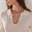 Load image into Gallery viewer, Moon and Stars Gold plated Pillar necklace worn by a female model together with other necklaces
