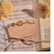 Load image into Gallery viewer, Stars And Moon Adjustable Ring with four other rings on top of a music sheet
