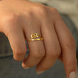Load image into Gallery viewer, A model wearing a 666 Angel Number Gold ring
