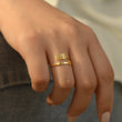 Load image into Gallery viewer, A model wearing a 888 Angel Number Gold ring
