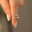 Load image into Gallery viewer, A model holding a 555 Angel Number Silver ring
