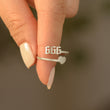 Load image into Gallery viewer, A model holding a 666 Angel Number Silver ring
