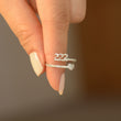 Load image into Gallery viewer, A model holding a 222 Angel Number Silver ring
