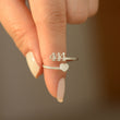 Load image into Gallery viewer, A model holding a 444 Angel Number Silver ring
