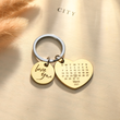 Load image into Gallery viewer, Personalized calendar keychain on a white piece of paper
