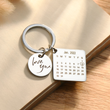 Load image into Gallery viewer, Personalized calendar keychain on a blank piece of paper
