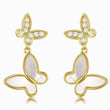 Load image into Gallery viewer, White Pearl Butterfly Drop Gold Earrings in a white background
