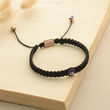 Load image into Gallery viewer, To My Grandson Evil Eye Braided Bracelet on top of an open book
