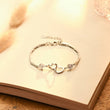 Load image into Gallery viewer, Thank You For Being My Soul Sister Heart Bracelet laying on top of an open book
