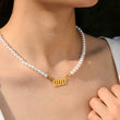 Load image into Gallery viewer, Model wearing a 000 angel number pearl gold necklace
