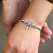 Load image into Gallery viewer, To My Daughter Dreamcatcher Bangle worn by a model oner her left wrist
