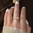 Load image into Gallery viewer, Female model wearing Customized Dog Bone Ring  on her middle finger
