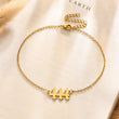 Load image into Gallery viewer, 444 Angel number gold anklet placed on top of a piece of paper

