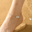 Load image into Gallery viewer, A model wearing a 444 Angel Number Silver-plated Anklet
