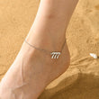 Load image into Gallery viewer, A model wearing a 777 Angel Number Silver-plated Anklet
