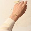 Load image into Gallery viewer, A model wearing an Angel Number 555 Bracelet on her left wrist
