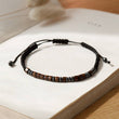 Load image into Gallery viewer, To My Daughter, I Love You Morse Code Bracelet  on the top of a book page 
