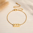 Load image into Gallery viewer, Angel Number 222 gold bracelet on a canvas background
