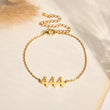Load image into Gallery viewer, Angel Number 444 gold bracelet on a canvas background
