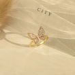 Load image into Gallery viewer, To My Daughter Sculpted Butterfly Ring on a book page
