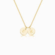 Load image into Gallery viewer, 2 gold disc pendants with engraved initial on gold necklace on white background
