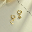 Load image into Gallery viewer, Moon and Shine Gold Earrings placed on top of a blank paper
