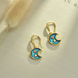 Load image into Gallery viewer, Blue Moon Gold Earrings placed on top of a blank canvas
