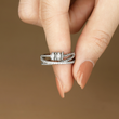 Load image into Gallery viewer, To My Daughter, I Will Protect You From Anything You Fear Fidget Ring held between a model&#39;s fingers 
