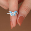 Load image into Gallery viewer, Butterfly fidget ring being held by a model
