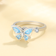 Load image into Gallery viewer, To My Daughter Butterfly Fidget Ring casting a light shadow on a surface
