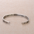 Load image into Gallery viewer, Motivational message &quot;and son the adventure begins&quot; engraved on a silver-plated bracelet placed on a brown fabric
