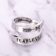 Load image into Gallery viewer, Be fearless spiral ring placed on top of a white marble
