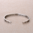 Load image into Gallery viewer, Motivational bracelet a gift for her, placed on top of a brown fabric
