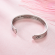 Load image into Gallery viewer, Bonus daughter bracelet with meaningful bracelet placed on top of pink fabric
