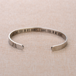 Load image into Gallery viewer, &quot;God Has You In His Hands, I Have You In My Heart&quot; printed in a bracelet placed on top of a brown fabric
