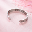 Load image into Gallery viewer, &quot;I am so proud of you&quot; silver bracelet placed on top of a pink fabric
