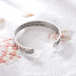 Load image into Gallery viewer, &quot;I am so proud of you&quot; silver-plated bracelet placed on top of sand
