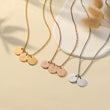 Load image into Gallery viewer, 3 custom initial necklaces in gold, rose gold, and silver, on beige summer background
