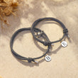 Load image into Gallery viewer, Personalized Magnetic Couple Bracelets on a canvas background
