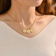 Load image into Gallery viewer, 3 gold disc pendants with engraved initial on gold necklace on female model
