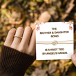 Load image into Gallery viewer, Model wearing a Two strand knot ring while holding a message card
