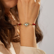 Load image into Gallery viewer, A model wearing Multicolored Charm White Evil Eye Red String Bracelet
