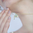 Load image into Gallery viewer, A model holding Eye of Horus Gold Chain Evil Eye Necklace
